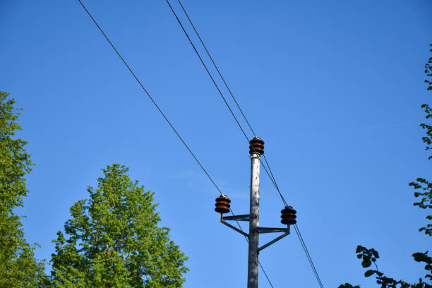 istock Power lines on a wooden pole 1254208480