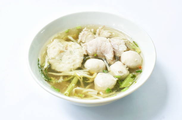 istock boiled soft slice pork and ball in clear soup 1254209397