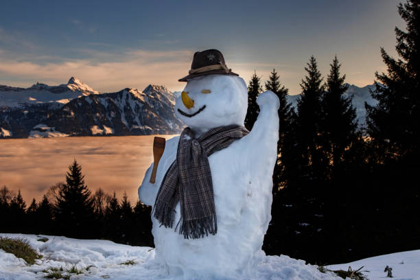 Detailed look at snowman's face on top of Mount Rigi with amazing view on Swiss Alps