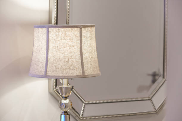 istock Pretty cosy lamp on a table at the morror 1254210739