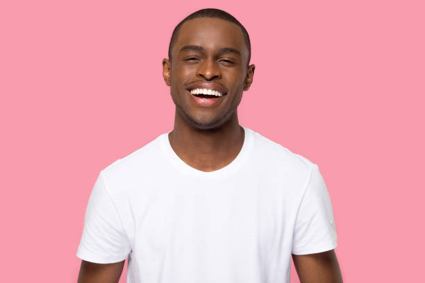 istock Head shot portrait smiling African American man looking at camera 1254214862