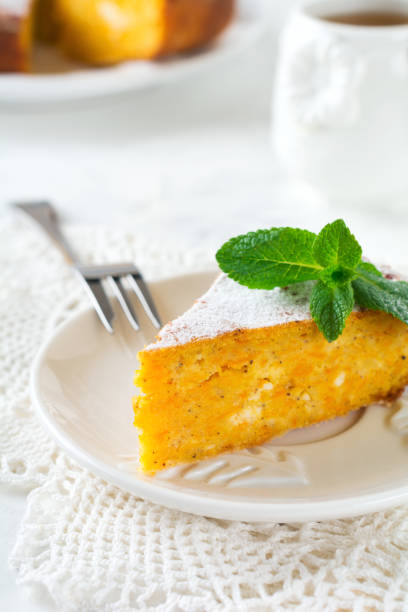 istock Slice cheese casserole with pumpkin and cinnamon for breakfast on ceramic plate  on a light background. Selective focus. 1254216284