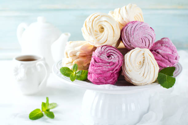 istock Homemade marshmallows on a light background. Russian currant and mango zephyr. Selective focus. 1254221327