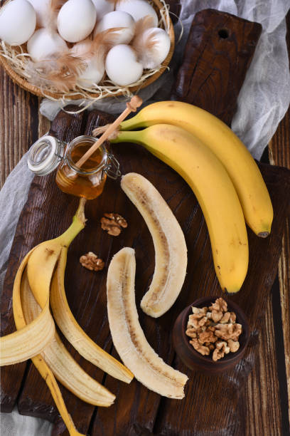 istock Bananas, nuts, eggs, honey - Ingredients for baking homemade banana bread 1254221517