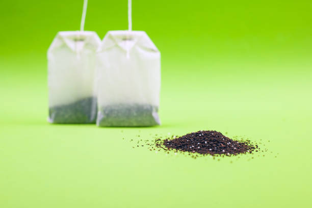 tea bags with lemon flavor on a green background.