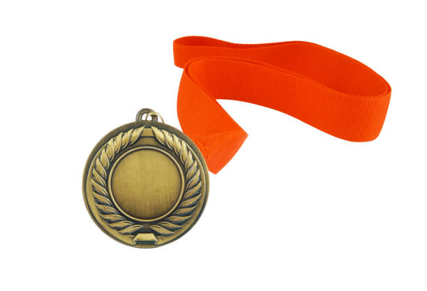istock Gold medal with red ribbon isolated 1254224245