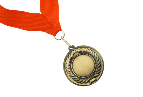 istock Gold medal with red ribbon isolated 1254224247