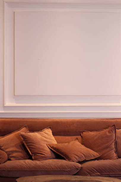 brown sofa on a white wall background. pillows on the sofa. - armchair sofa leather brown imagens e fotografias de stock