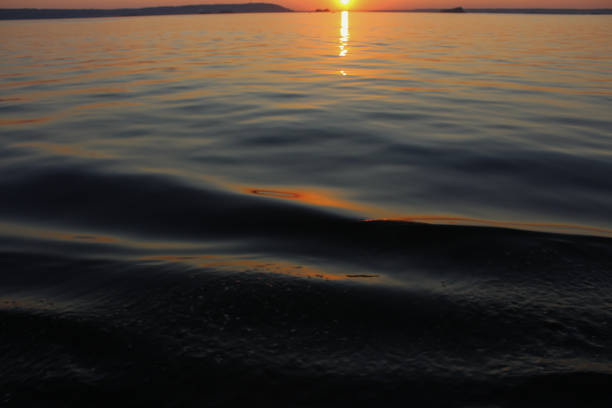istock Sunset at sea. Sky and water 1254225755