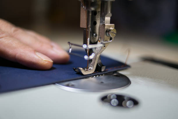 istock A man sews from leather on a sewing machine. Hands and sewing. 1254226749