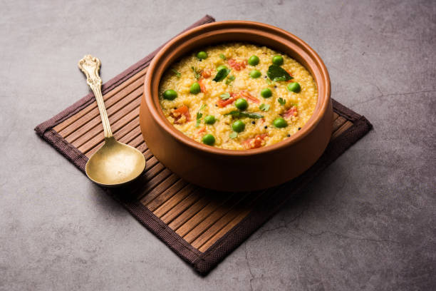 Dalia khichdi or Daliya Khichadi is a delicious one pot meal made from broken wheat and vegetables, Indian food stock photo