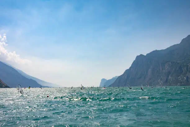 Windsurfing at Garda Lake, view from the shore – Torbole, Lombardy, Italy