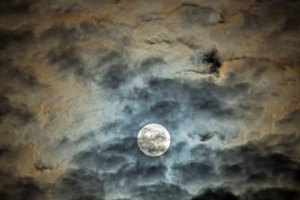 Photo of Full moon in the cirrus clouds.