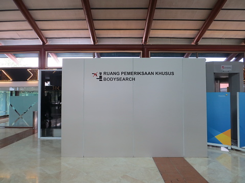 Jakarta, Indonesia - September 17, 2019: Security check body search booth at Terminal 2 Domestic Departure Soekarno-Hatta International Airport.