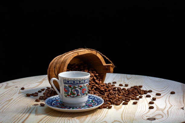 istock coffee cup, coffee grains on wooden table 1254231227