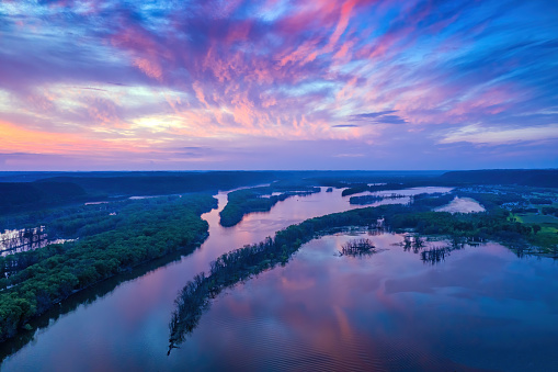 Aerial view of reflections of sunset over islands in the Mississippj River between Iowa and Wisconsin.