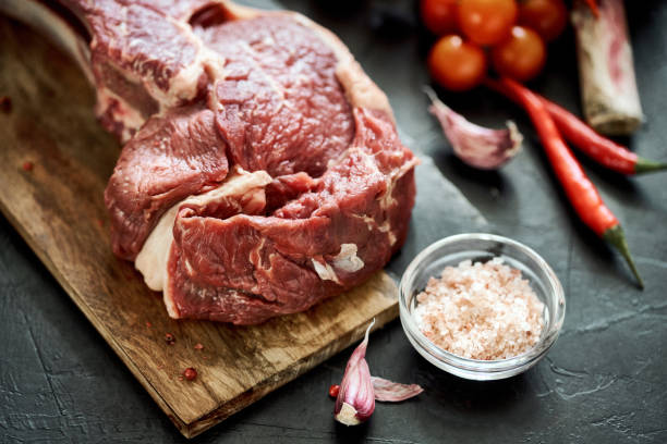 istock Raw cowboy steak andvegetables 1254235582