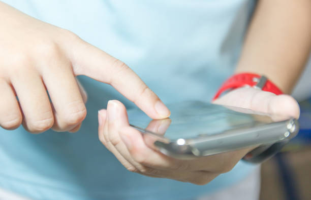 istock Close up of A man using mobile smart phone. 1254239125