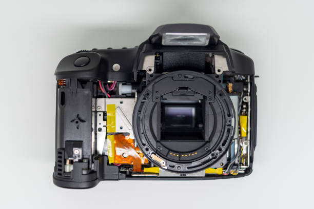 istock Taking apart and repairing digital photo camera. 1254240083