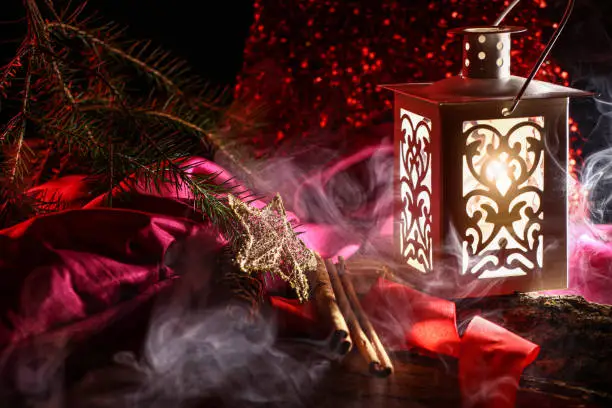 Red christmas background with candles and copy space and lantern