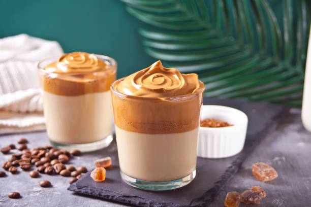 istock Dalgona Coffee. Fluffy creamy whipped coffee on the concrete background. Trendy beverage. 1254240746