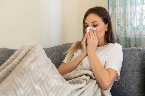 istock Young sick women  suffering from cold 1254244181