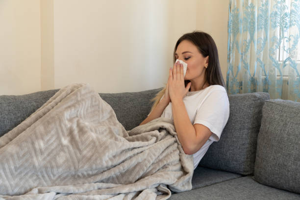 istock Young sick women  suffering from cold 1254245610
