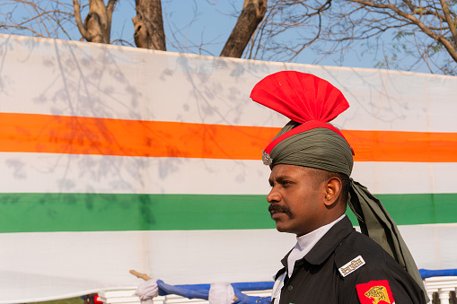 Kolkata, West Bengal, India - 23rd Jannuary 2019 : Indian army man with decoated turban and Indian flag in the background at Red Road, Kolkata.