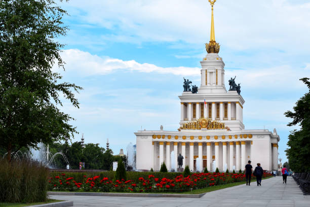 Moscow, Russia - July 2, 2020: Main pavilion in VDNKh park against the blue sky with clouds