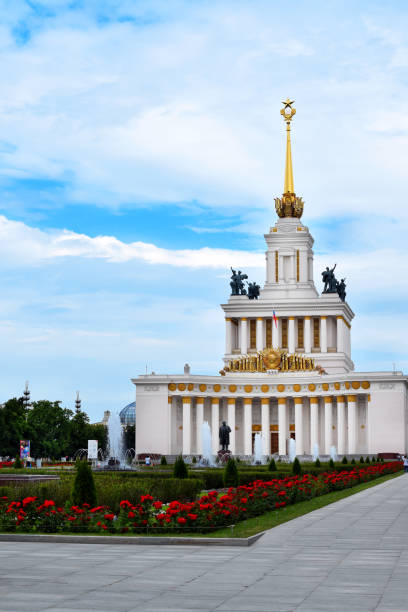 Moscow, Russia - July 2, 2020: Main pavilion in VDNKh park against the blue sky with clouds