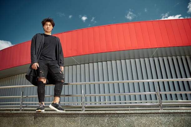 istock Handsome young man standing on the street on sunny day 1254250607