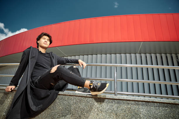 istock Handsome young man resting on the street 1254250612