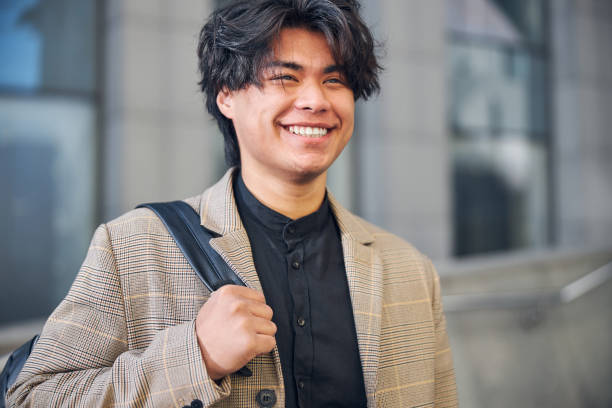 istock Attractive young man looking away and smiling 1254250671