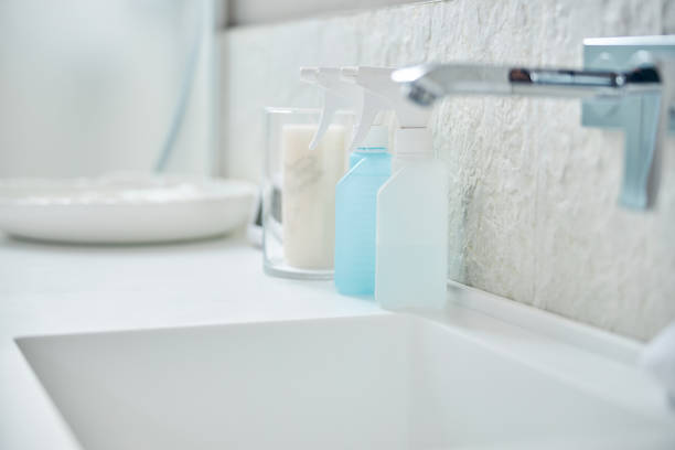 istock Bath tap above the white sink with various sprays 1254250774