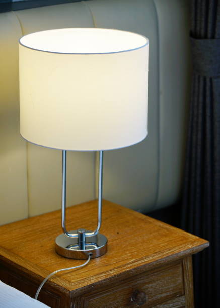 istock Classic lamp on wooden table 1254251832