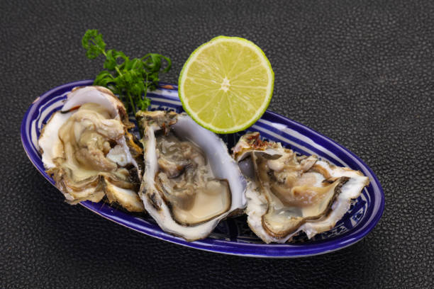 istock Oysters with lime and parsley 1254265748