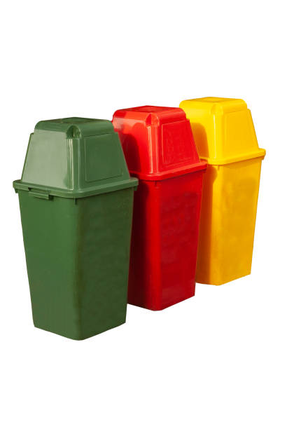 istock Garbage trash bins for waste segregation. Separate waste collection food waste, plastic, paper and danger waste on white background with clipping path. 1254268324