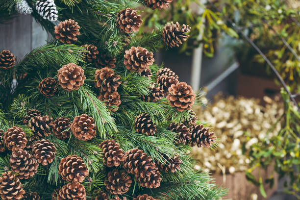 istock Pine branches with natural and painted pine cones 1254272760