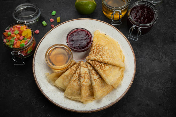 istock Pancakes with honey, jam and candied fruit 1254274269
