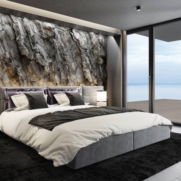 istock Mountain rock stone wall in luxurious apartment master bedroom interior 1254278000
