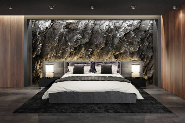 istock Mountain rock stone wall in luxurious apartment master bedroom interior 1254278086