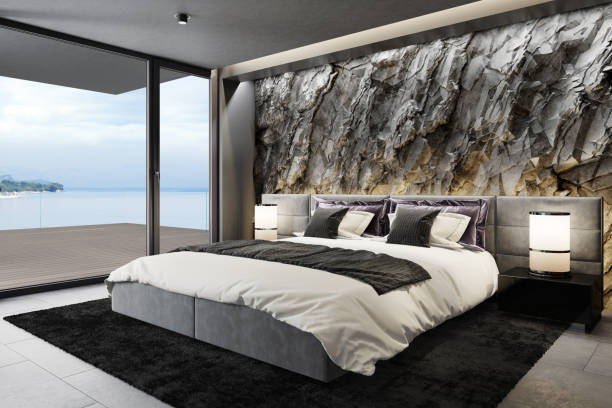 istock Mountain rock stone wall in luxurious apartment master bedroom interior 1254278140
