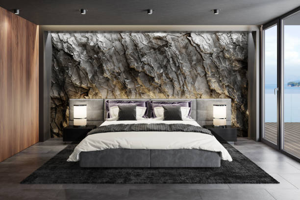 istock Mountain rock stone wall in luxurious apartment master bedroom interior 1254278151