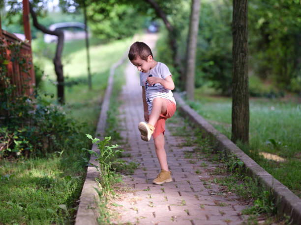 Toddler boy is so happy to play in the garden