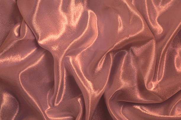 istock Smooth elegant pink silk or satin texture can use as background 1254279145