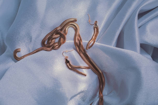 istock gold jewelry on luxurious fabric 1254279157