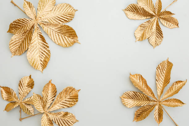 istock Frame of golden leaves. 1254280554