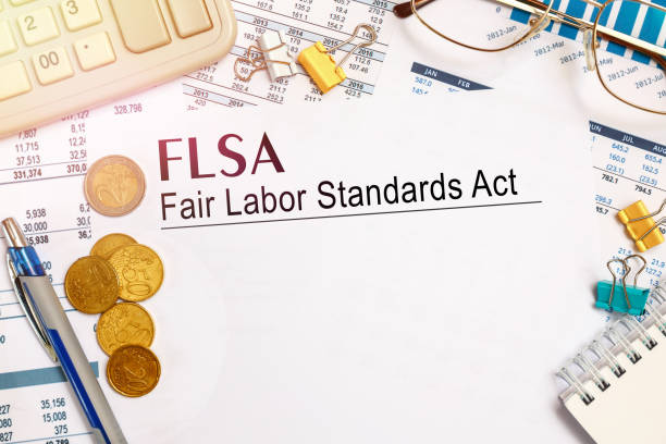 Paper with FLSA Fair Labor Standards Act on a tabl stock photo