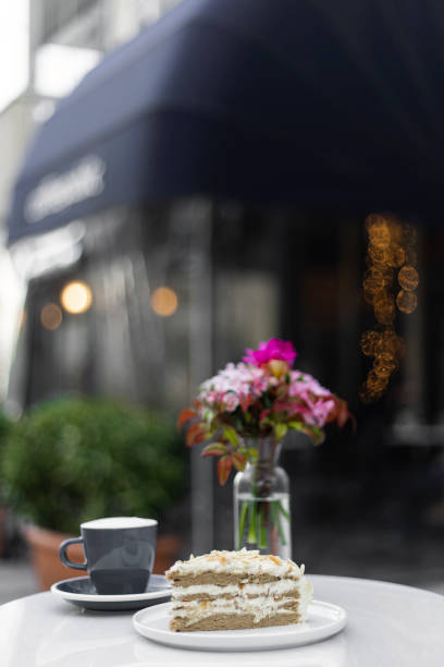 Cake and a Cup of Coffee with Cafe Background