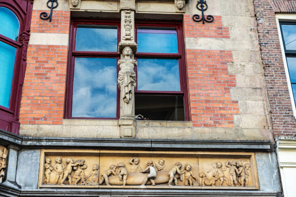 Amsterdam, Netherlands - September 9, 2018: Sculpture in the facade of Keizersgracht 508 street in the old town of Amsterdam, Netherlands